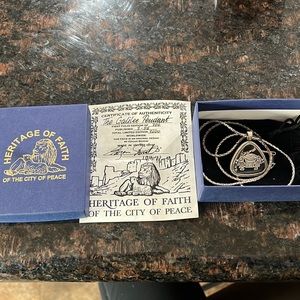 First edition with certificate of authenticity pendant